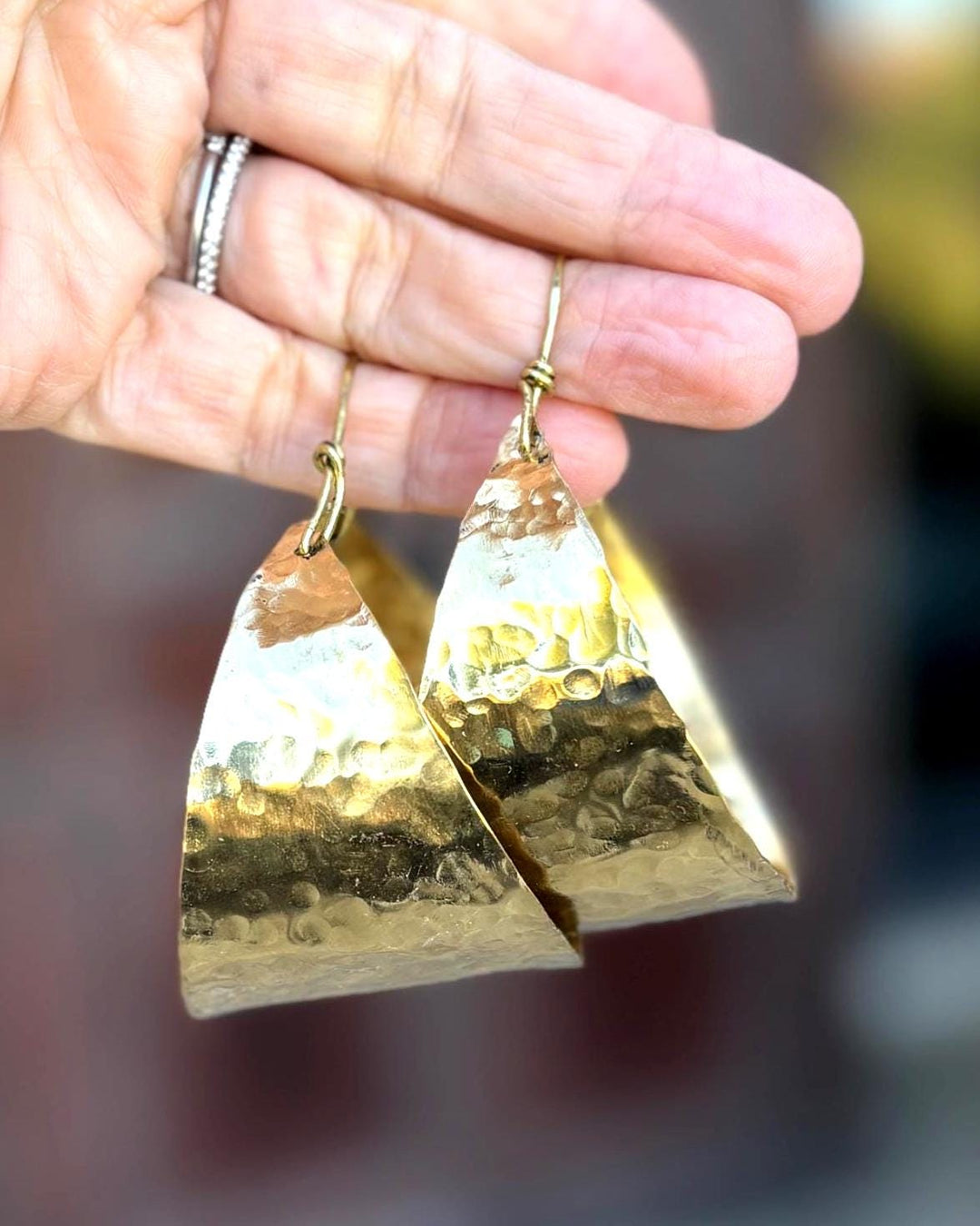 Are these bold hammered brass hoop earrings comfortable for all-day wear?